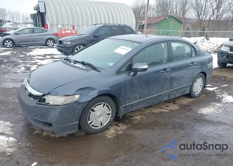 2009 Honda Civic Hybrid from USA, damaged, VIN JHMFA362X9S010374